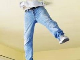 Man dangling from hole in ceiling